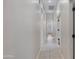 Long hallway with tile flooring and access to other rooms at 1971 E Yellowstone Pl, Chandler, AZ 85249