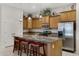 Kitchen with island, stainless steel appliances, and wood cabinets at 1971 E Yellowstone Pl, Chandler, AZ 85249