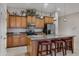 Kitchen with island, stainless steel appliances, and wood cabinets at 1971 E Yellowstone Pl, Chandler, AZ 85249