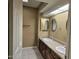 Bright bathroom with double sinks and mirrored medicine cabinets at 2121 W Union Hills Dr # 115, Phoenix, AZ 85027