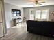 Spacious living room with hardwood floors and access to a patio at 2121 W Union Hills Dr # 115, Phoenix, AZ 85027