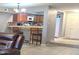 Comfortable living room showcases a breakfast bar with seating, connecting the living space to the kitchen at 2121 W Union Hills Dr # 115, Phoenix, AZ 85027