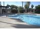 Community pool with a spa and surrounding patio at 2121 W Union Hills Dr # 115, Phoenix, AZ 85027