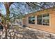 Home's backyard features a patio, gravel landscaping, and mature trees at 21364 N Redington Point Dr, Surprise, AZ 85387