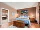 Main bedroom with king-size bed and ensuite bathroom access at 21364 N Redington Point Dr, Surprise, AZ 85387