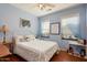 Charming bedroom with a queen-size bed and ample closet space at 21364 N Redington Point Dr, Surprise, AZ 85387