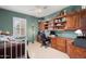 Bedroom with built-in wood desk and shelving at 21364 N Redington Point Dr, Surprise, AZ 85387