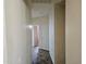 Hallway with neutral walls and lovely tile floors leading to other rooms in the home at 21364 N Redington Point Dr, Surprise, AZ 85387