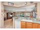 Kitchen features a breakfast bar overlooking the living room at 21364 N Redington Point Dr, Surprise, AZ 85387
