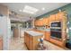 Spacious kitchen with island, stainless steel appliances, and ample cabinetry at 21364 N Redington Point Dr, Surprise, AZ 85387