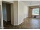 Spacious living room with tile floors, neutral walls, and natural light from the windows at 21364 N Redington Point Dr, Surprise, AZ 85387