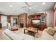 Living Room with sectional sofa and entertainment center at 21364 N Redington Point Dr, Surprise, AZ 85387