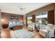 Main bedroom with hardwood floors and sitting area at 21364 N Redington Point Dr, Surprise, AZ 85387