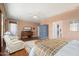 Relaxing main bedroom with plush seating and hardwood floors at 21364 N Redington Point Dr, Surprise, AZ 85387