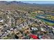 Aerial view of home and surrounding area, including golf course and mountains at 23335 N Country Club Trl, Scottsdale, AZ 85255