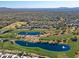 Aerial view of community with golf course and water features at 23335 N Country Club Trl, Scottsdale, AZ 85255