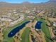 Aerial view of community and golf course with lakes at 23335 N Country Club Trl, Scottsdale, AZ 85255