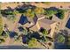 An aerial view of the house, highlighting its roofline and landscaping at 23335 N Country Club Trl, Scottsdale, AZ 85255