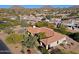 An aerial view of a home with a terracotta tile roof, surrounded by desert landscaping at 23335 N Country Club Trl, Scottsdale, AZ 85255