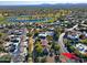 Aerial view of a house on a quiet street, near a golf course and lake at 23335 N Country Club Trl, Scottsdale, AZ 85255