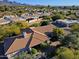Aerial view of house and surrounding neighborhood, showcasing mountain views at 23335 N Country Club Trl, Scottsdale, AZ 85255