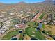 Aerial view of community with golf course, pool, and clubhouse at 23335 N Country Club Trl, Scottsdale, AZ 85255