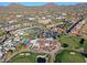 Aerial view highlighting clubhouse, pool, and surrounding golf course at 23335 N Country Club Trl, Scottsdale, AZ 85255