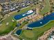 Stunning aerial view of a golf course community with lakes at 23335 N Country Club Trl, Scottsdale, AZ 85255
