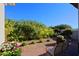 Landscaped backyard with gravel, flowers, and seating at 23335 N Country Club Trl, Scottsdale, AZ 85255