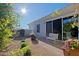 Sunny patio with seating and flowers in large pots at 23335 N Country Club Trl, Scottsdale, AZ 85255
