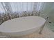 Luxurious bathroom featuring a large soaking tub and modern fixtures at 23335 N Country Club Trl, Scottsdale, AZ 85255