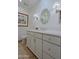 Bathroom with a vanity, toilet, and decorative mirror at 23335 N Country Club Trl, Scottsdale, AZ 85255