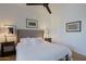 Bedroom with tufted headboard and ceiling fan at 23335 N Country Club Trl, Scottsdale, AZ 85255