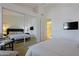 Main bedroom with mirrored closet doors and ensuite bath at 23335 N Country Club Trl, Scottsdale, AZ 85255