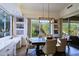 Bright dining area with built-in shelving and view of the backyard at 23335 N Country Club Trl, Scottsdale, AZ 85255