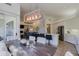 Kitchen dining area with a rustic wooden table and upholstered chairs at 23335 N Country Club Trl, Scottsdale, AZ 85255