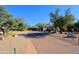 Landscaped driveway leading to a charming single story home at 23335 N Country Club Trl, Scottsdale, AZ 85255