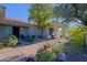 Landscaped front yard with a pathway and desert plants at 23335 N Country Club Trl, Scottsdale, AZ 85255