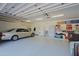 Two-car garage with overhead storage and shelving at 23335 N Country Club Trl, Scottsdale, AZ 85255
