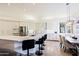 Eat-in kitchen with island, stainless steel appliances, and white cabinets at 23335 N Country Club Trl, Scottsdale, AZ 85255
