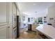 Modern kitchen with white cabinets, stainless steel appliances, and an island at 23335 N Country Club Trl, Scottsdale, AZ 85255
