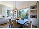 Breakfast nook with a charming table and view to garden at 23335 N Country Club Trl, Scottsdale, AZ 85255
