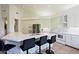 Modern kitchen with white cabinets and large island at 23335 N Country Club Trl, Scottsdale, AZ 85255
