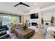 Gathering room with fireplace and built-in shelving at 23335 N Country Club Trl, Scottsdale, AZ 85255