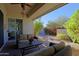 Relaxing patio with seating area, lush landscaping, and views of the garden at 23335 N Country Club Trl, Scottsdale, AZ 85255
