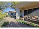 Covered patio with wicker furniture, offering a peaceful outdoor space at 23335 N Country Club Trl, Scottsdale, AZ 85255