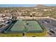 Aerial view of well-maintained tennis courts in a residential community at 23335 N Country Club Trl, Scottsdale, AZ 85255
