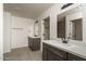 Bathroom with double vanity, tile flooring, and shower at 24520 W Duane Ln, Wittmann, AZ 85361