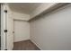 Large walk-in closet with double hanging rods at 24520 W Duane Ln, Wittmann, AZ 85361