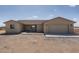 New single-story home with a two-car garage and desert landscaping at 24520 W Duane Ln, Wittmann, AZ 85361